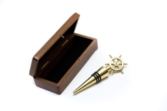 Brass wine stopper with NI2348 steering wheel motif in a wooden box