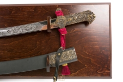 Noble karabela with a scabbard of the 18th century Armenian on the hanging table the blade is etched, chrome - replica
