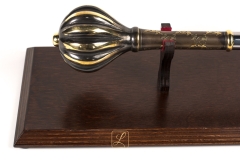 Brass mace on a wooden table, promotion, nomination, honorary award